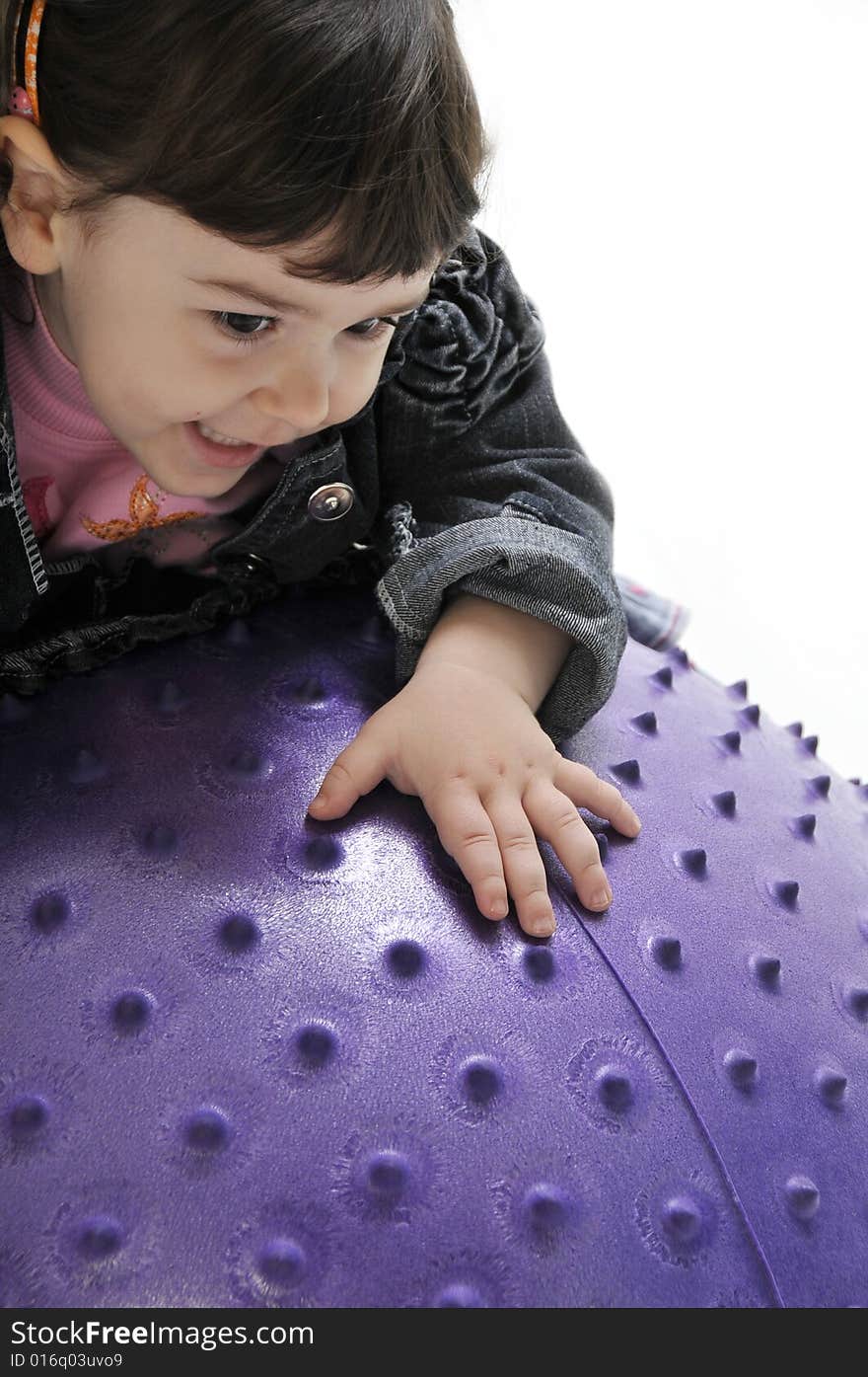 The girl played with balls for exercises. The girl played with balls for exercises