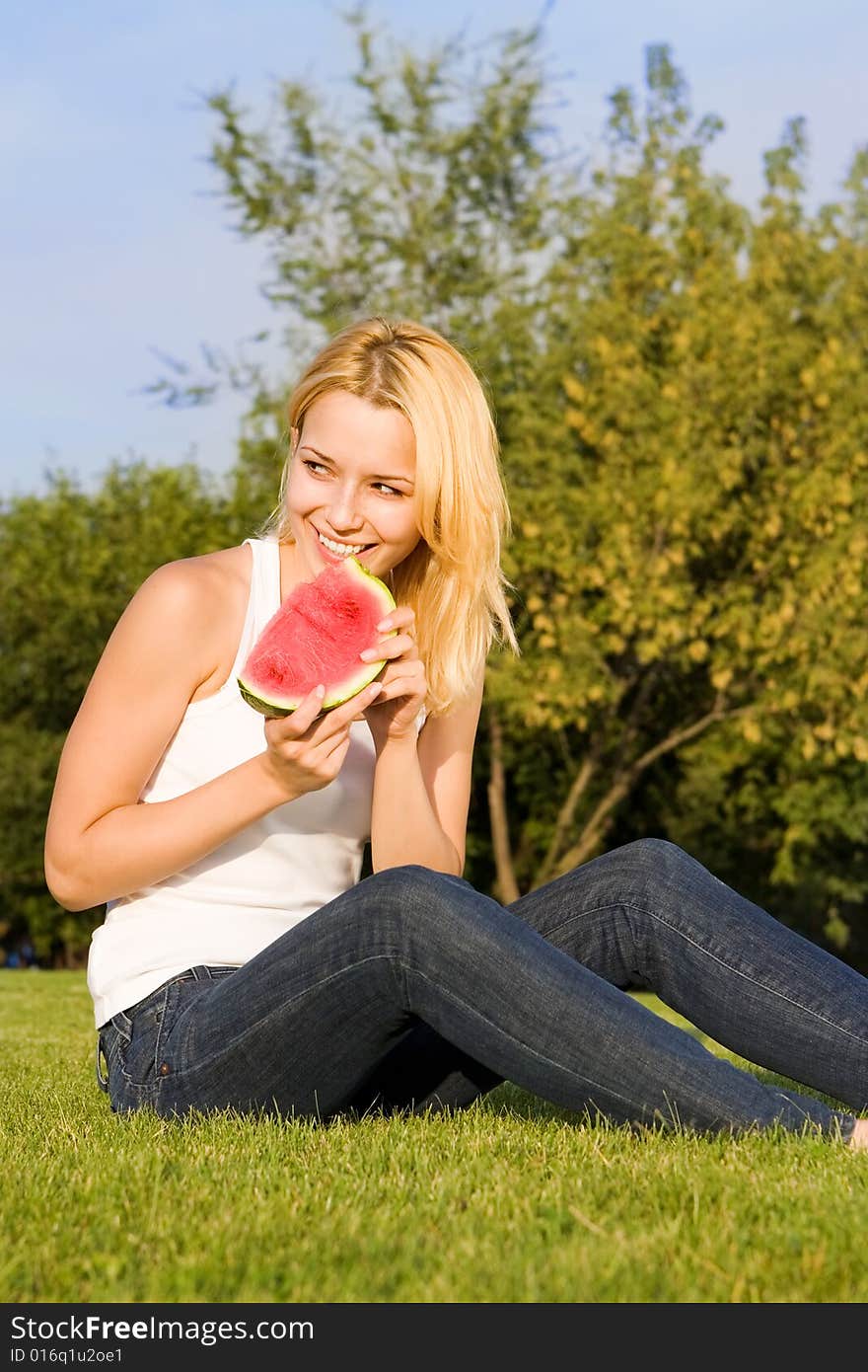 Young Blonde Eats Watermelon