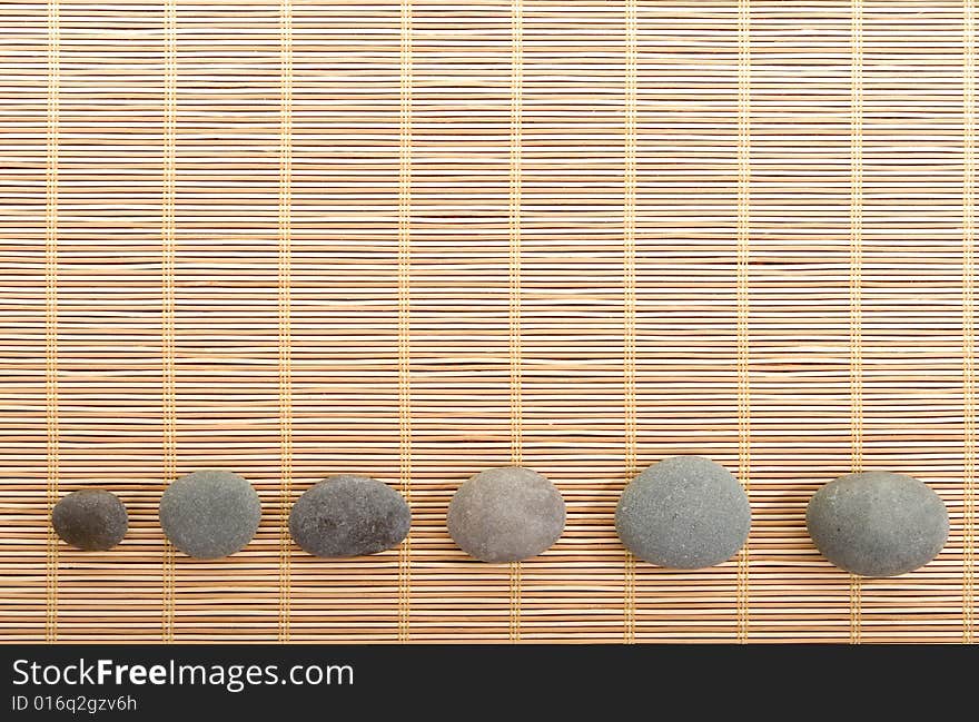 Balanced stones isolated on wooden background