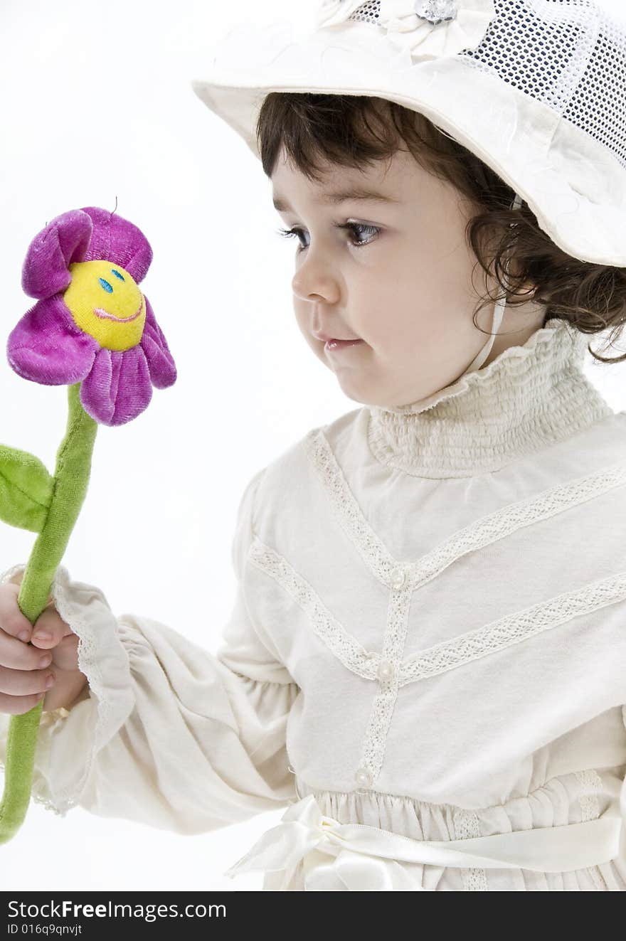 Portrait of a be single little girl with a flower