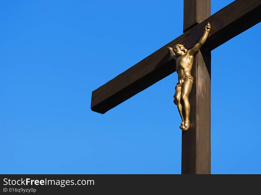 Detail cross with a blue sky background. Detail cross with a blue sky background
