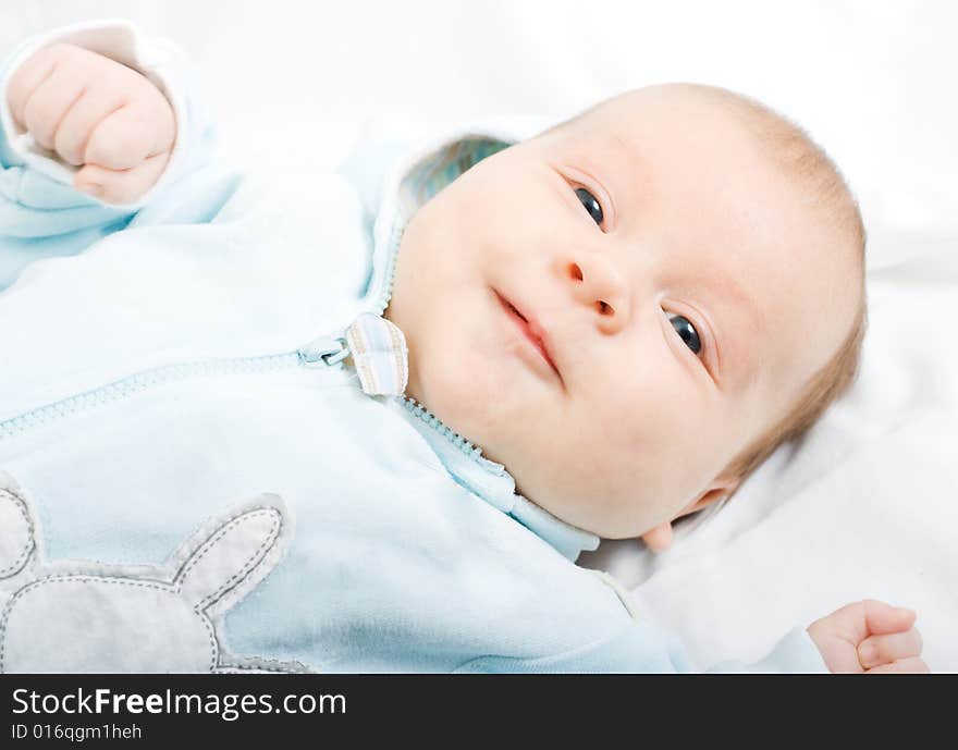 Little baby lying down on white background. Little baby lying down on white background.