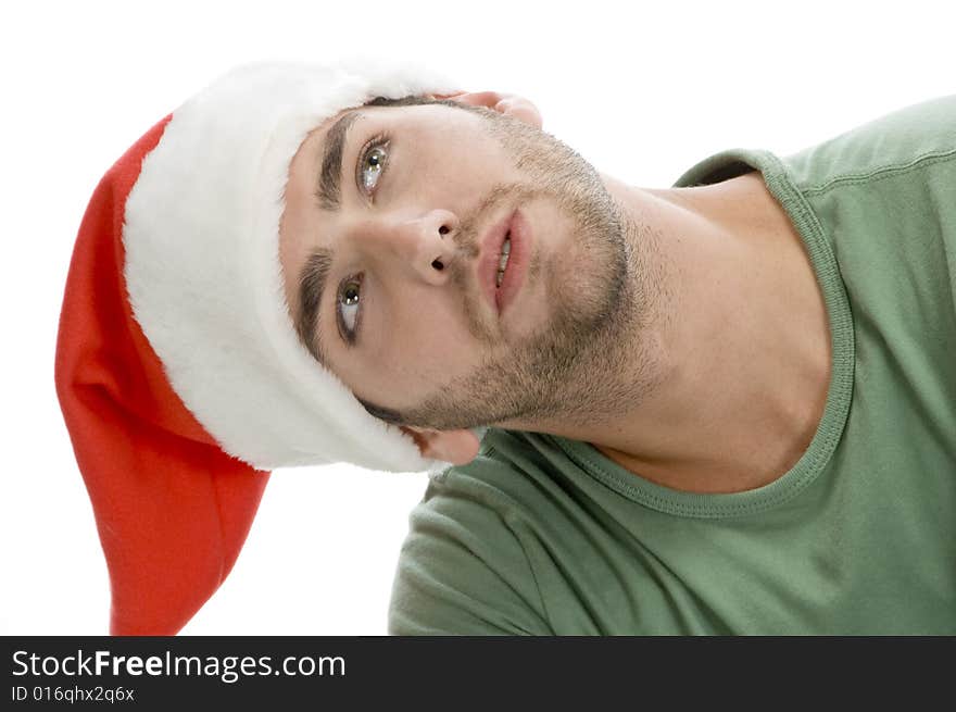 Man with Santa cap and looking upward with white background