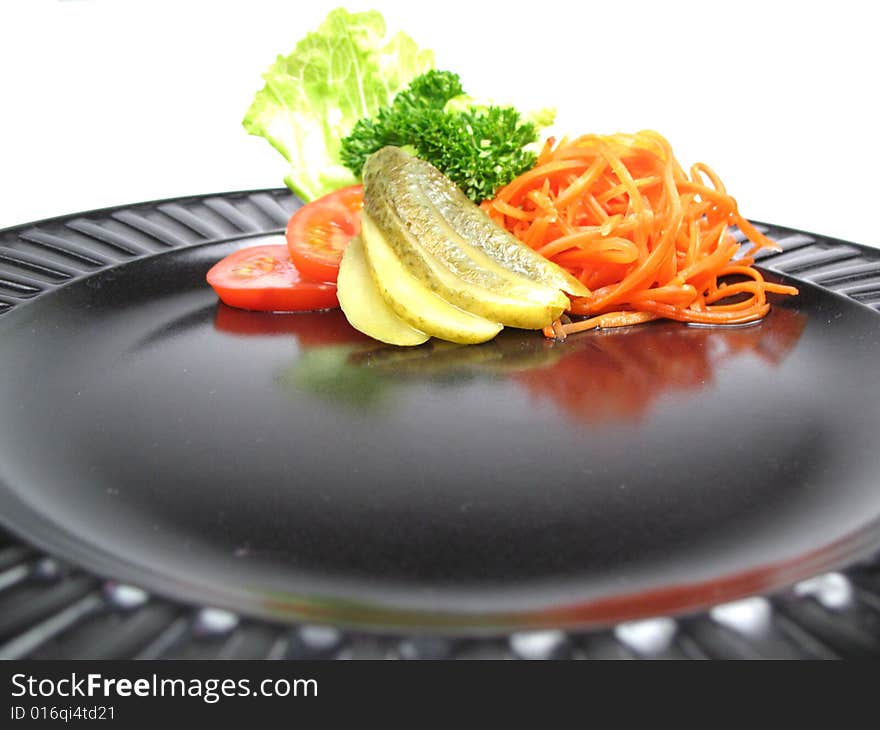 Salad on black plate