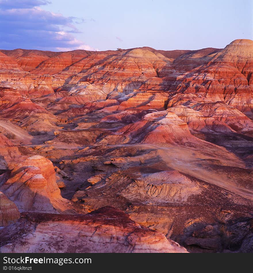 A colorful gorge in sunset. The rock of the gorge becomes red in the sun. It's a view of west China