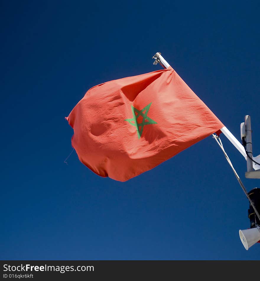 Flag of Morocco waving on a ferry boat. Flag of Morocco waving on a ferry boat