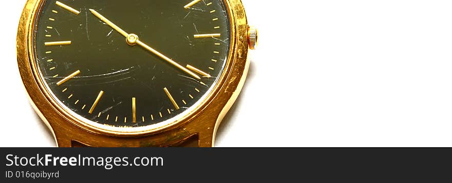 Closeup of gold watch face