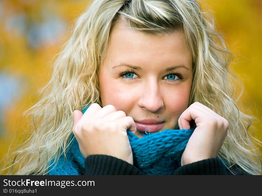 Young woman in autumn yellow forest