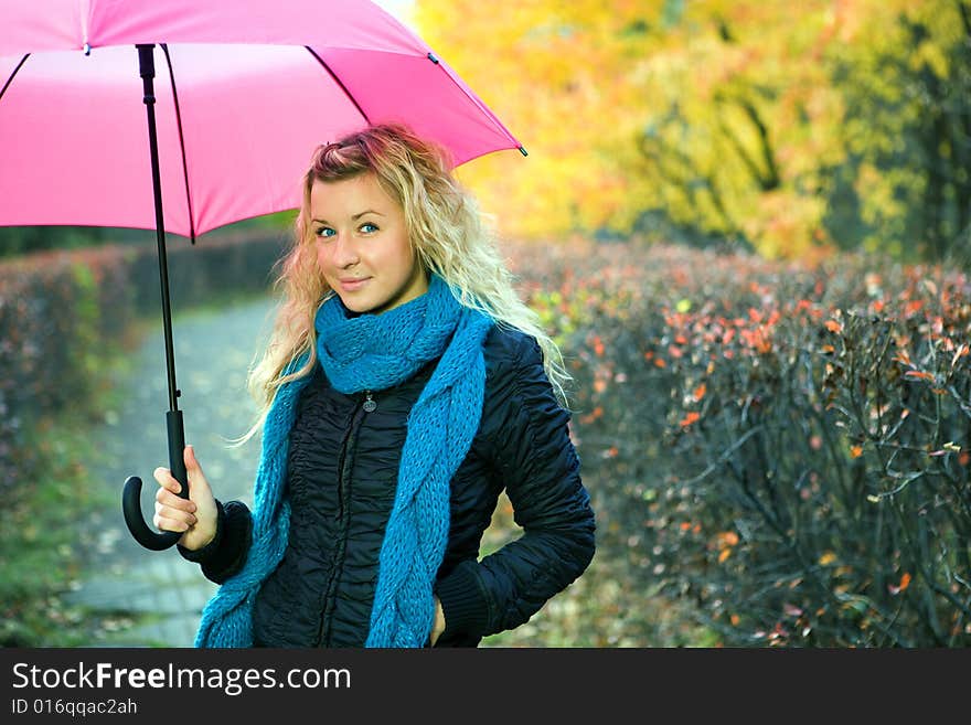 Young woman in autumn yellow forest