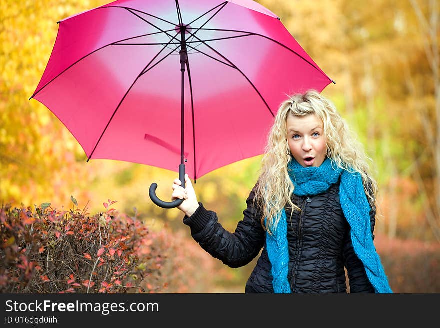 Young woman in autumn yellow forest