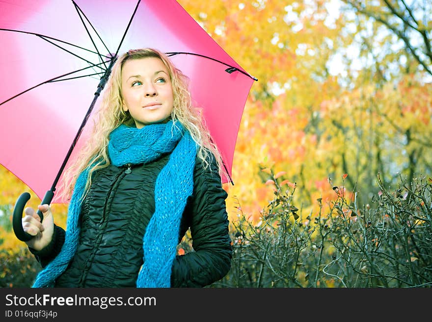 Young woman in autumn yellow forest