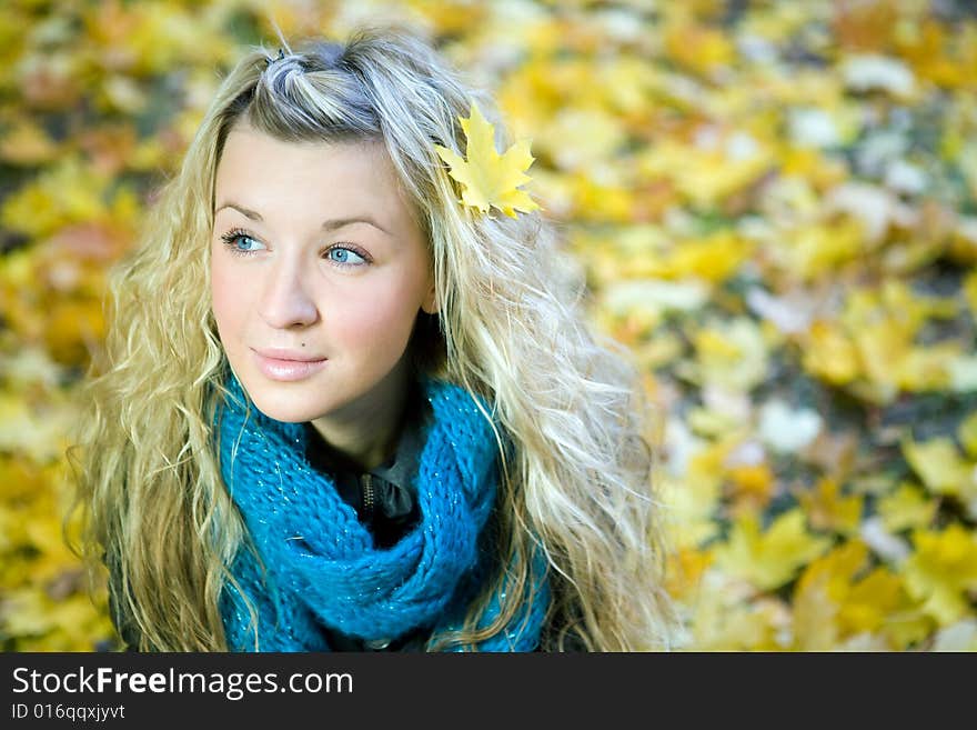 Young woman in autumn yellow forest