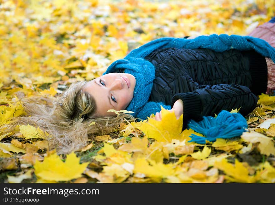 Young woman in autumn yellow forest