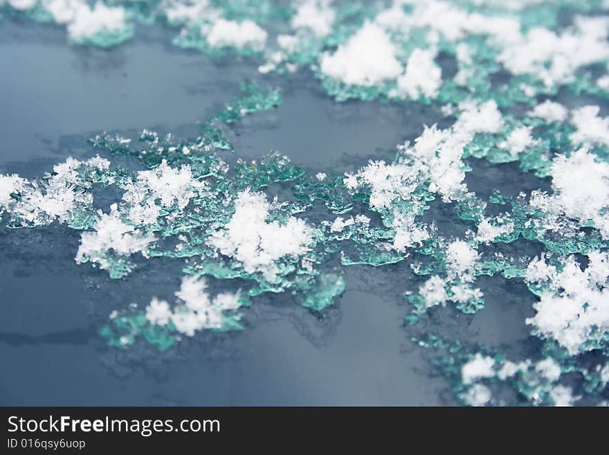 Snow thaws on the glass