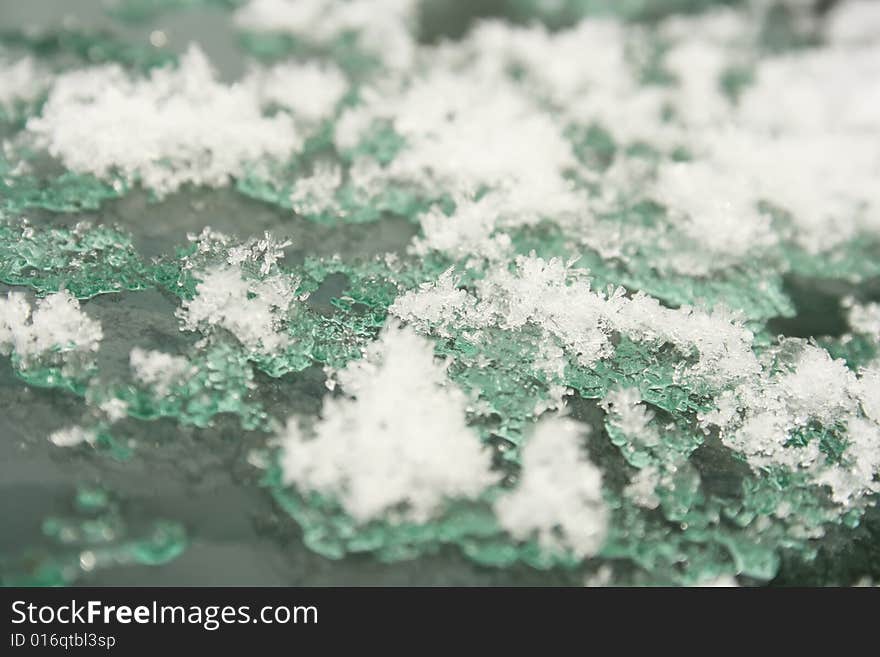 Snow thaws on the glass