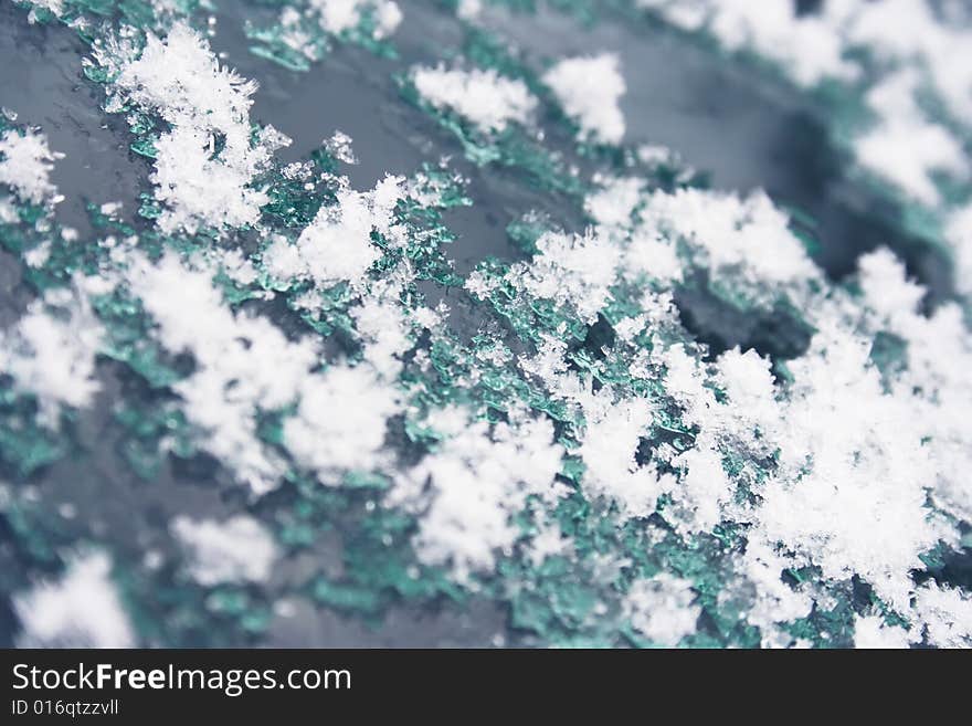 Snow thaws on the glass