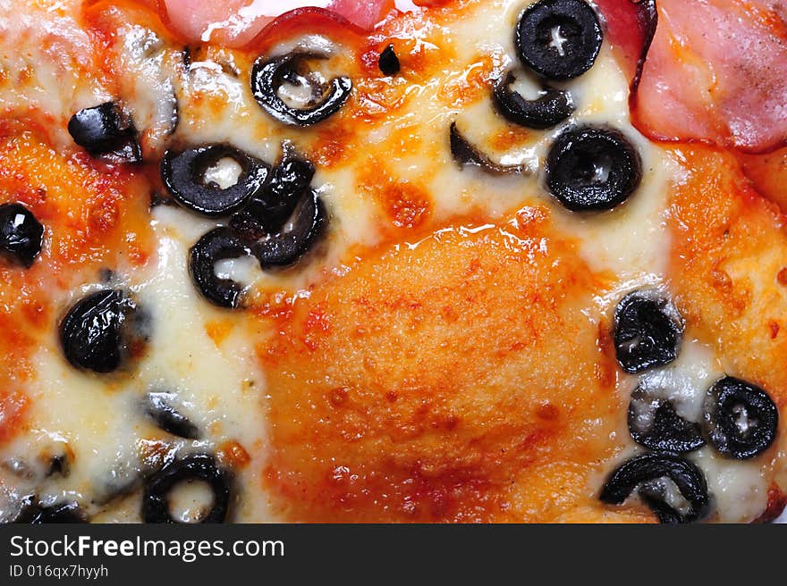 Top view of pizza on white background; extreme close up