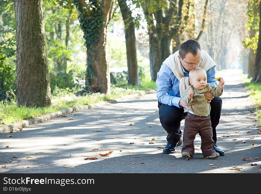 Father and son park autumn. Father and son park autumn