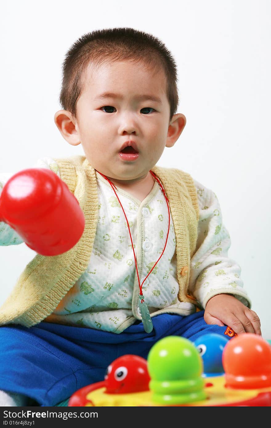 Young chinese boy play with toy. Young chinese boy play with toy