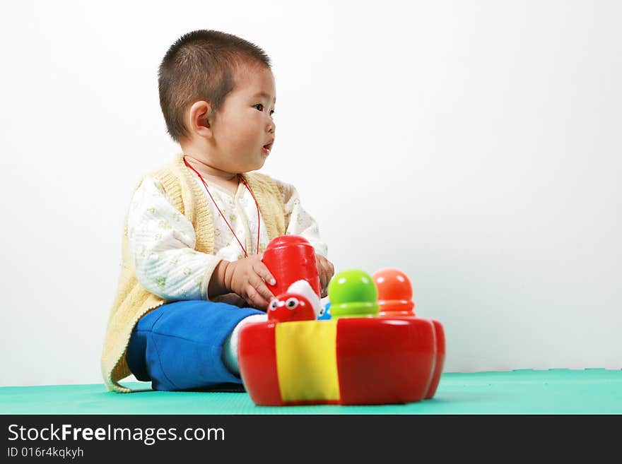 Young chinese boy play with toy. Young chinese boy play with toy