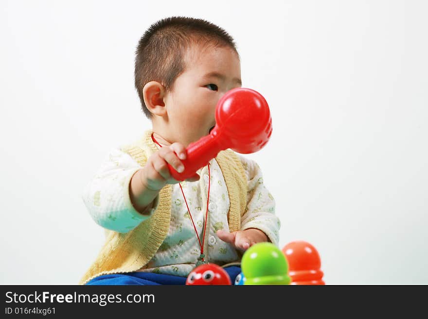 Young chinese boy play with toy. Young chinese boy play with toy