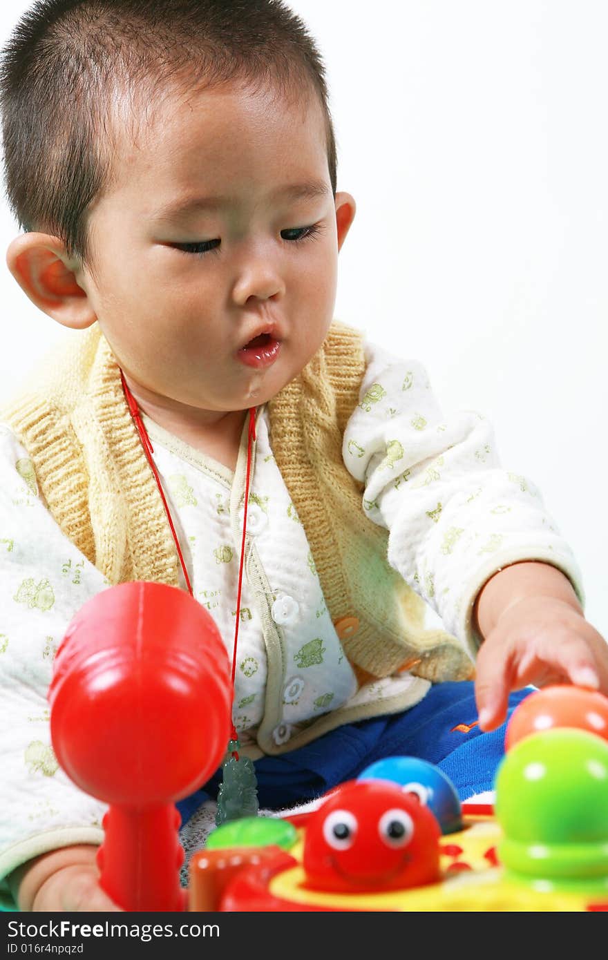 Young chinese boy play with toy. Young chinese boy play with toy