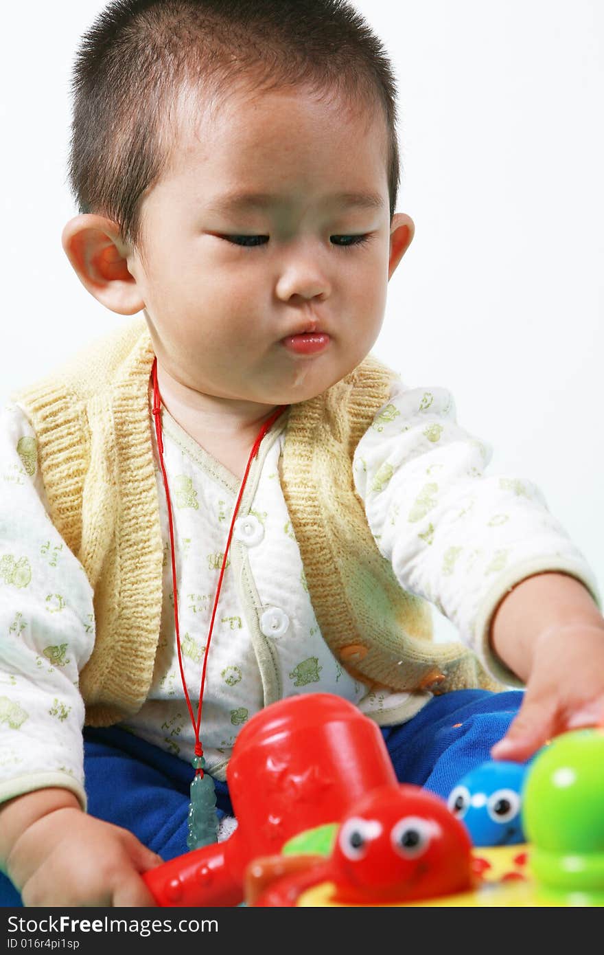 Young chinese boy play with toy. Young chinese boy play with toy