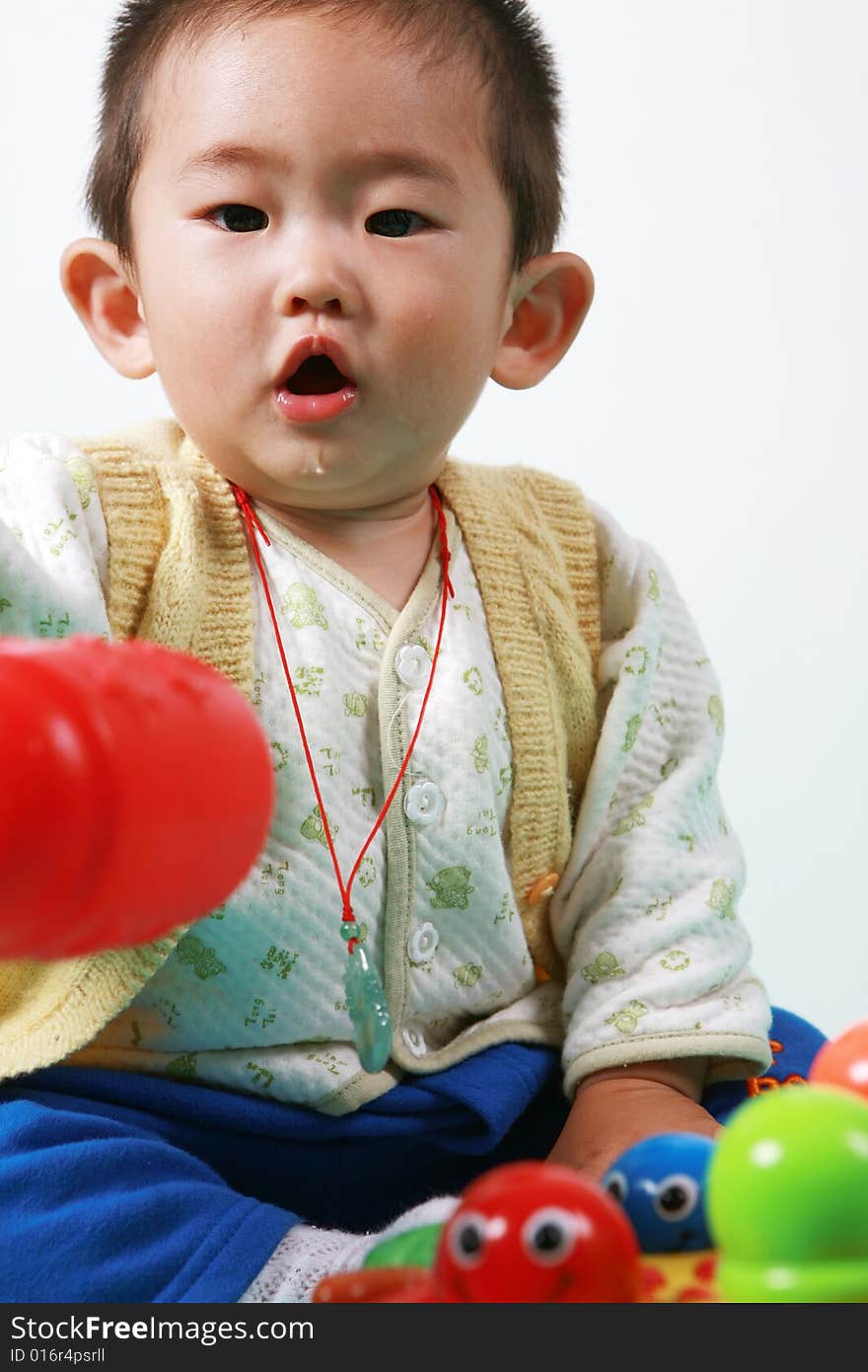 Young chinese boy play with toy. Young chinese boy play with toy