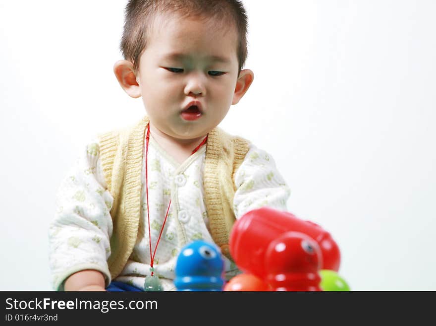 Young chinese boy play with toy. Young chinese boy play with toy