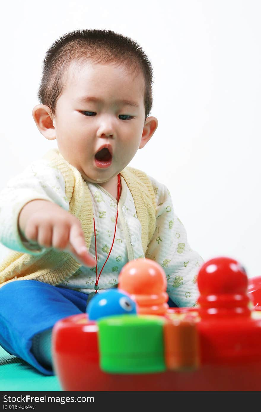 Young chinese boy play with toy. Young chinese boy play with toy