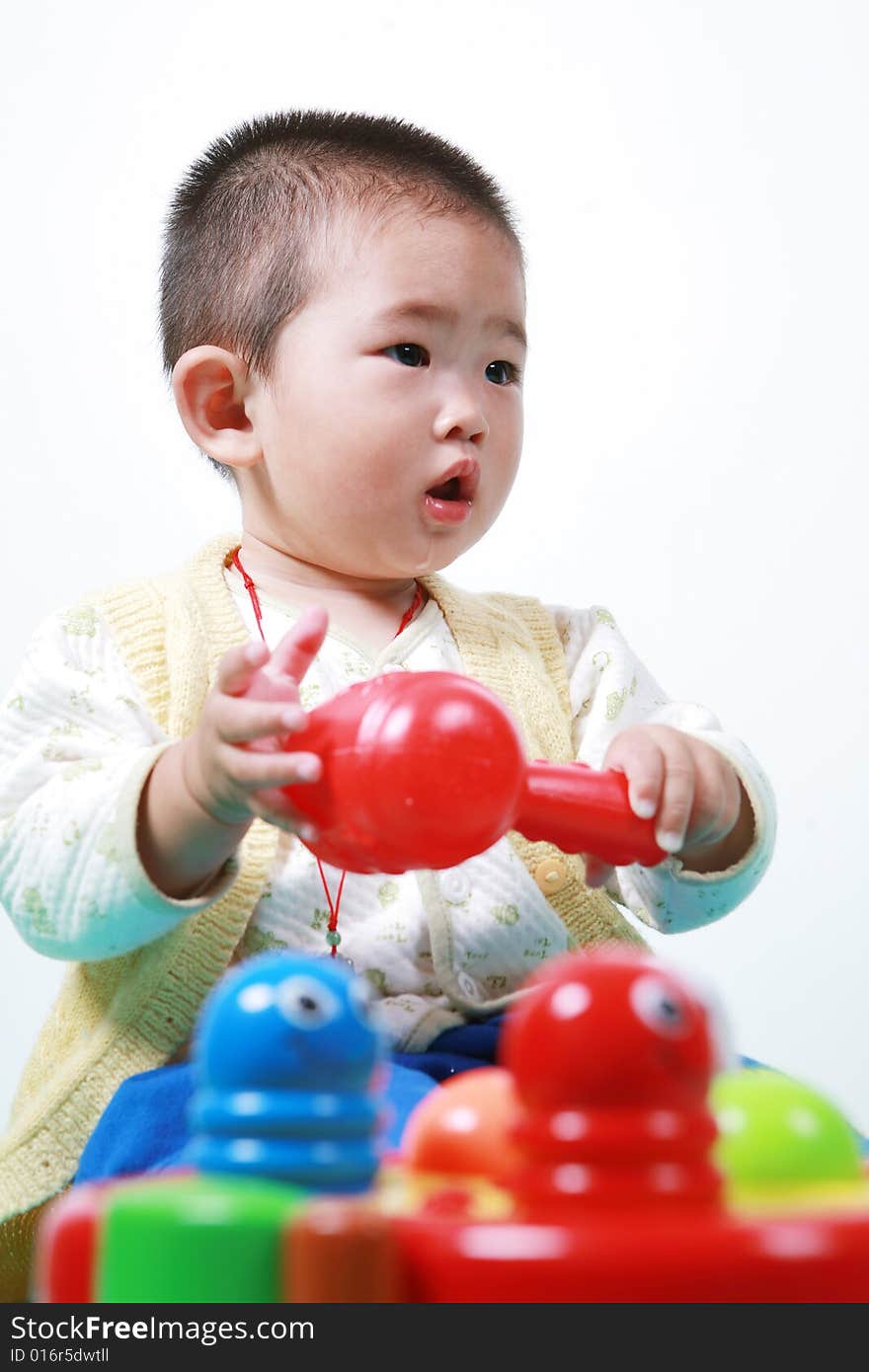 Young chinese boy play with toy. Young chinese boy play with toy