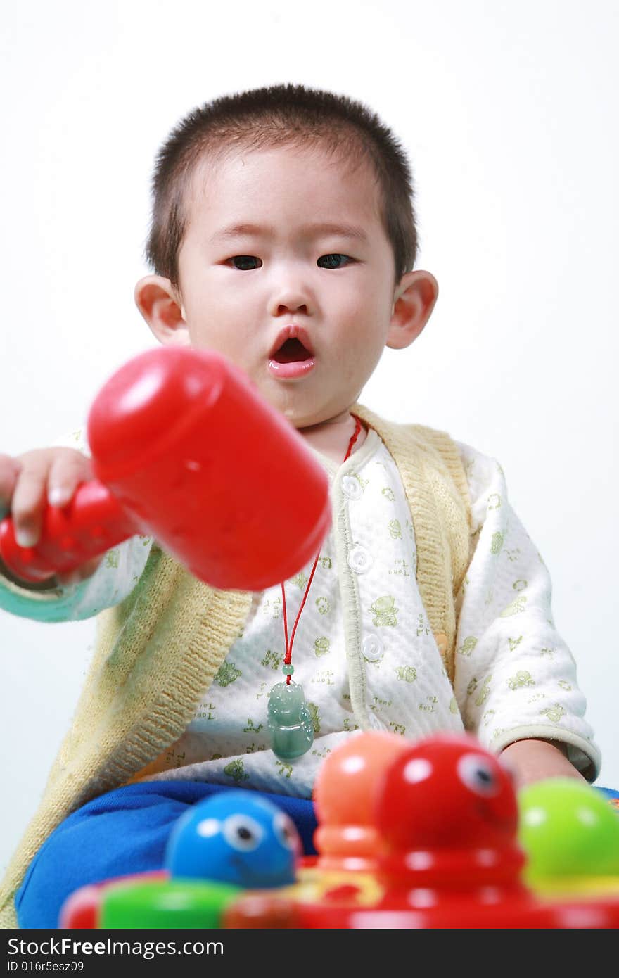 Young chinese boy play with toy. Young chinese boy play with toy