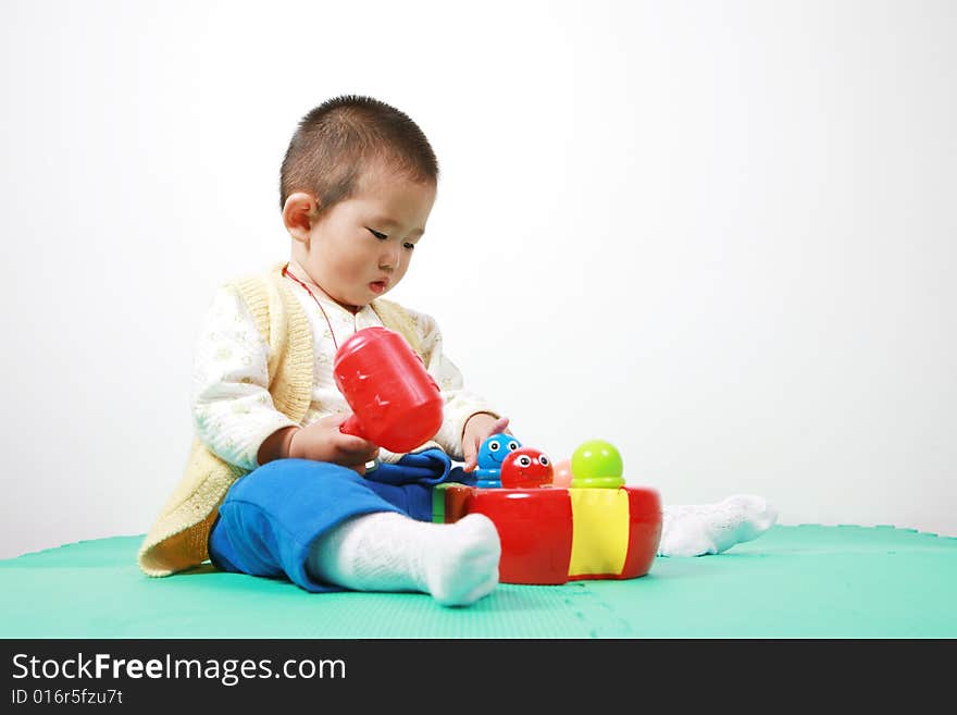 Young chinese boy play with toy. Young chinese boy play with toy