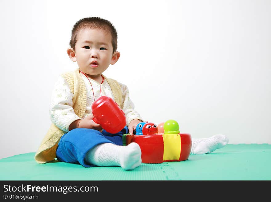 Young chinese boy play with toy. Young chinese boy play with toy