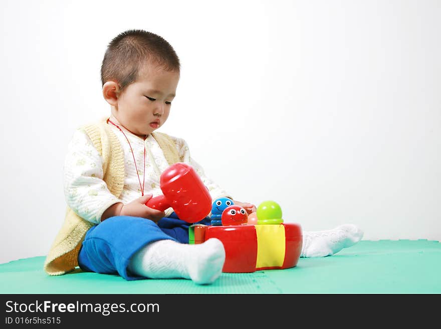 Young chinese boy play with toy. Young chinese boy play with toy