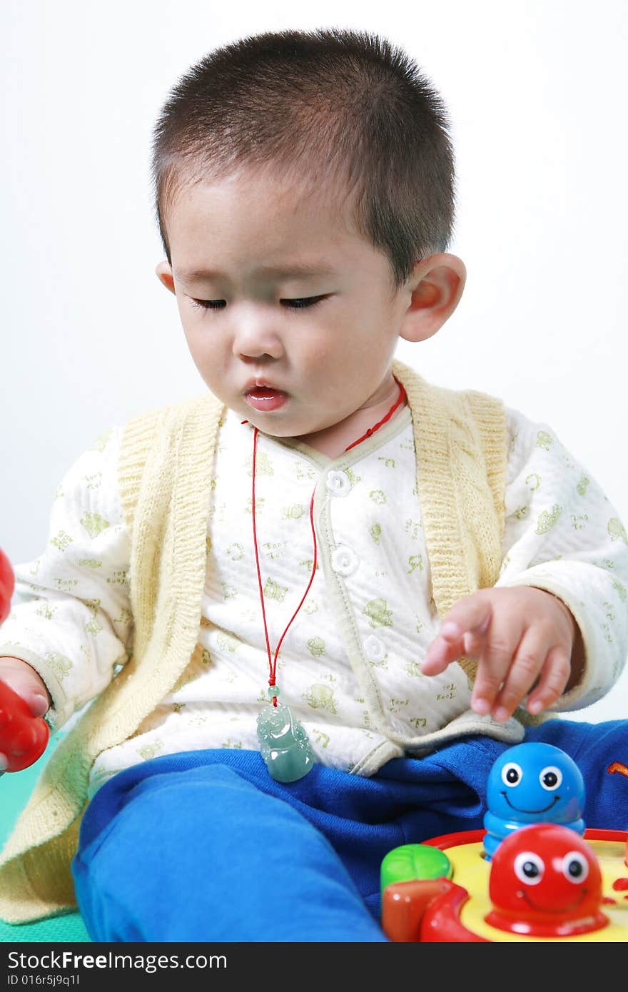 Young chinese boy play with toy. Young chinese boy play with toy