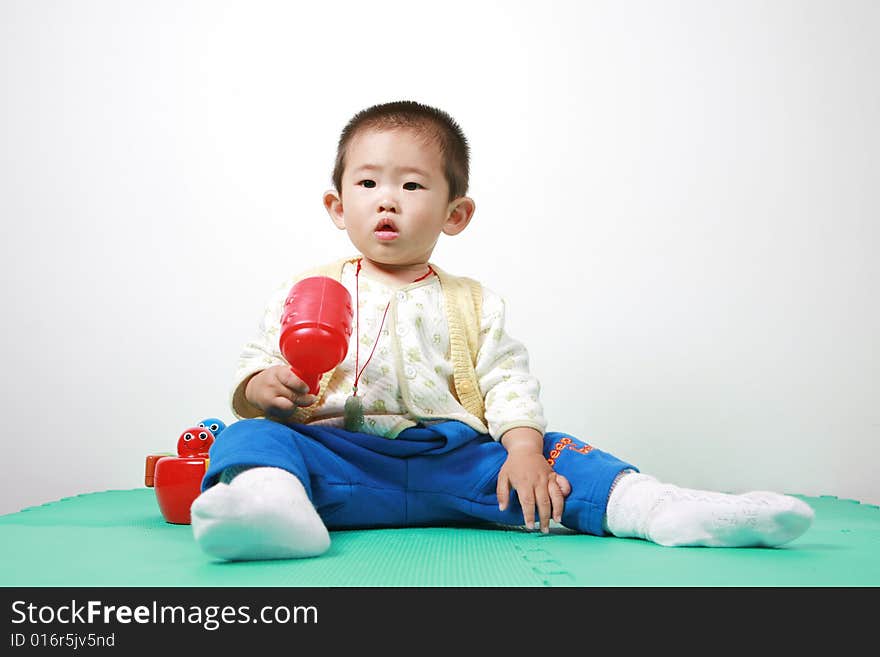 Young chinese boy play with toy. Young chinese boy play with toy