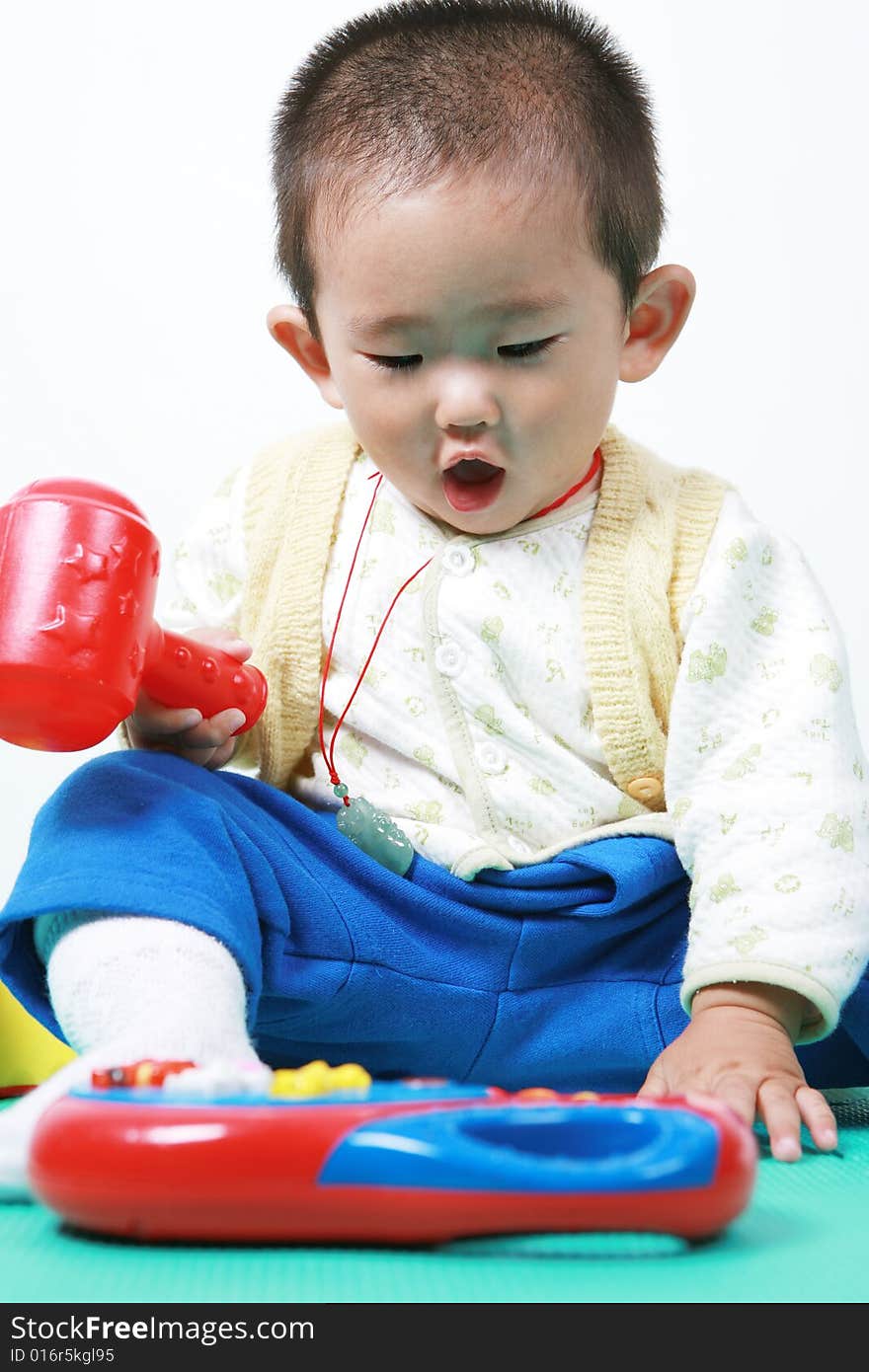 Young chinese boy play with toy. Young chinese boy play with toy