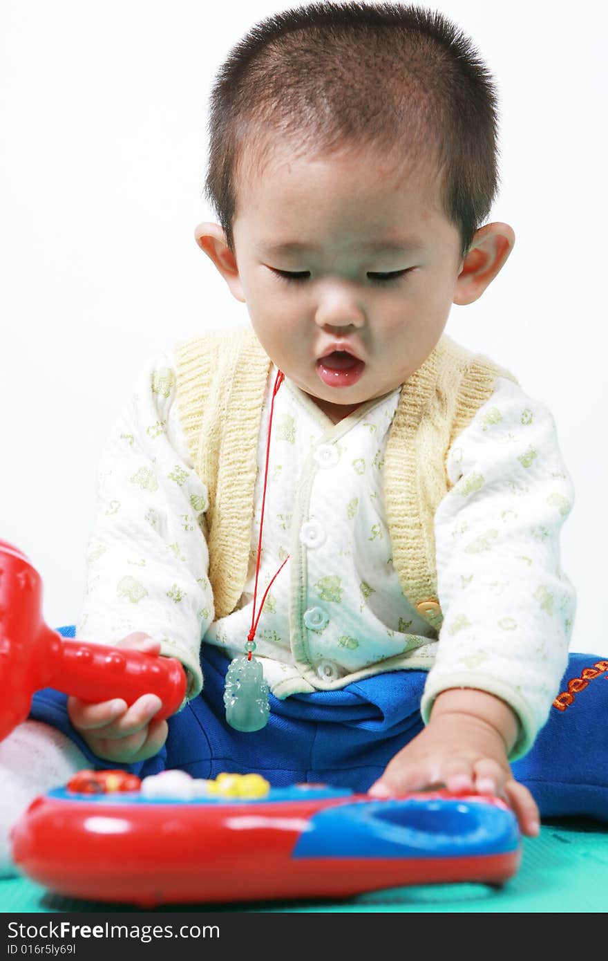 Young chinese boy play with toy. Young chinese boy play with toy