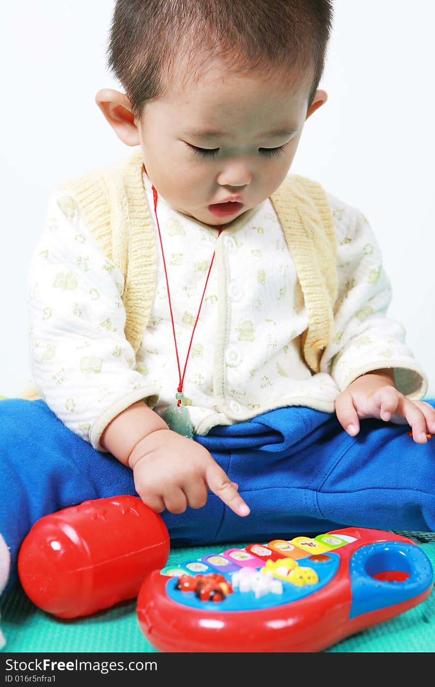 Young chinese boy play with toy. Young chinese boy play with toy