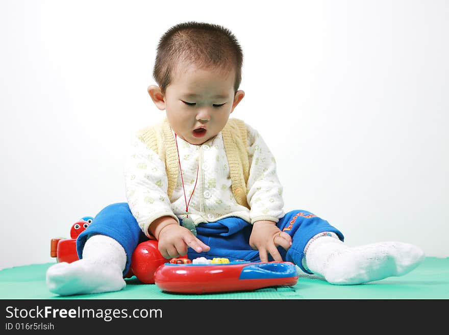 Young chinese boy play with toy. Young chinese boy play with toy