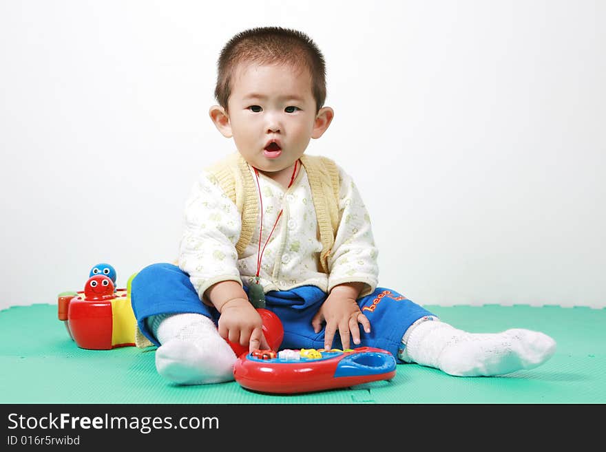 Young chinese boy play with toy. Young chinese boy play with toy