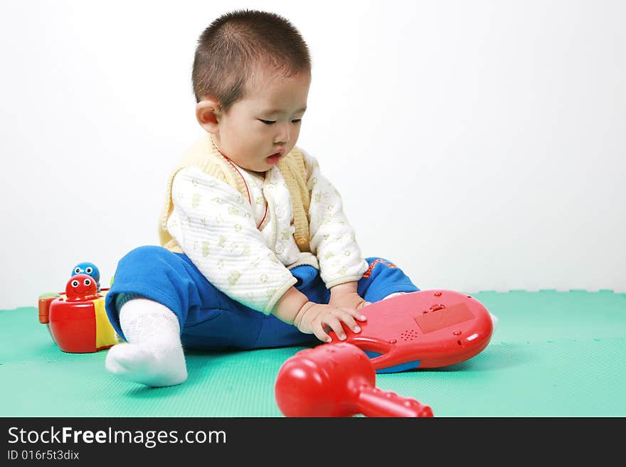 Young chinese boy play with toy. Young chinese boy play with toy