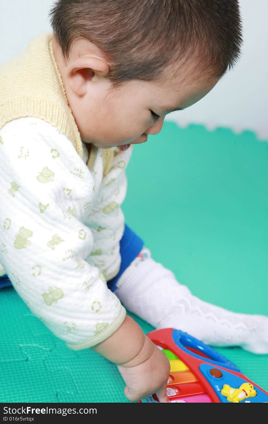 Young chinese boy play with toy. Young chinese boy play with toy