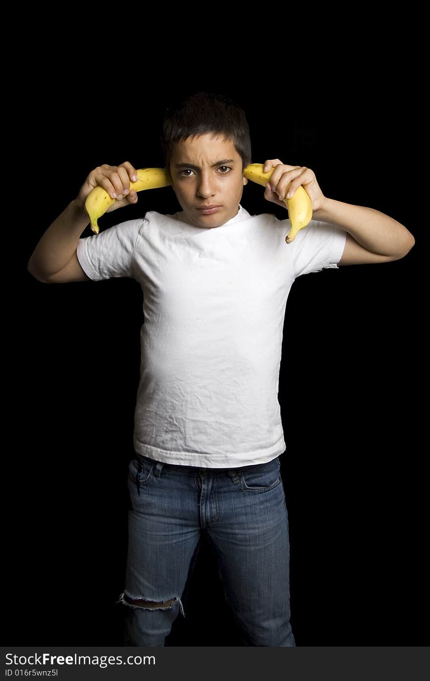 Teenage boy cannot hear you because of bananas in his ears