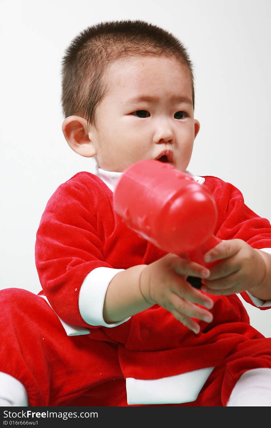 Cute chinese baby boy in a santas outfit. Cute chinese baby boy in a santas outfit