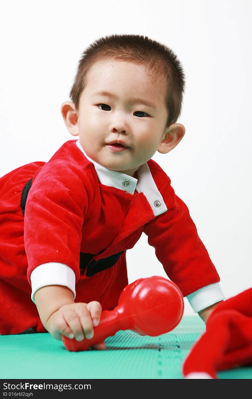 Cute chinese baby boy in a santas outfit. Cute chinese baby boy in a santas outfit