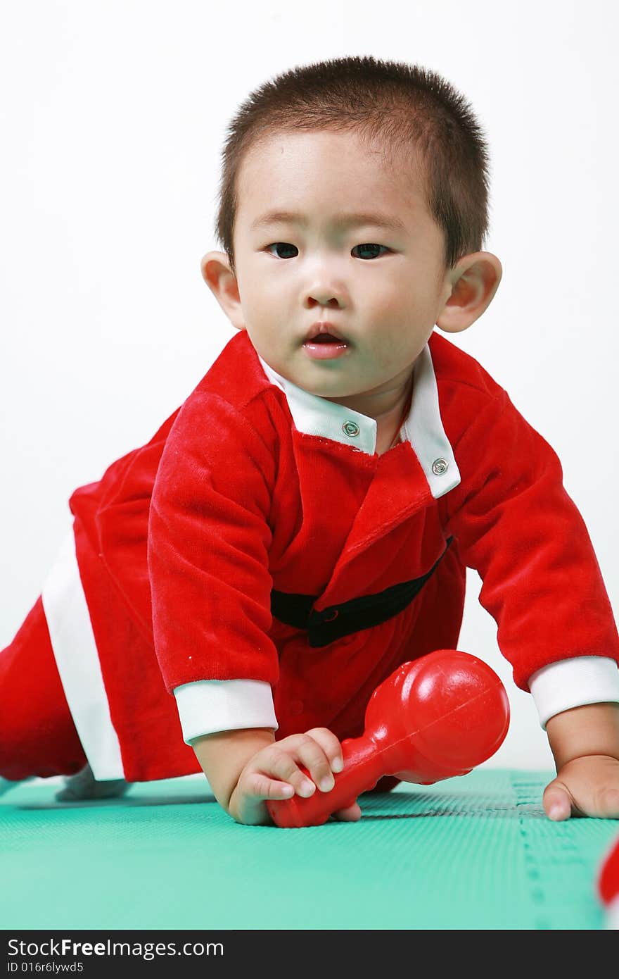 Cute chinese baby boy in a santas outfit. Cute chinese baby boy in a santas outfit