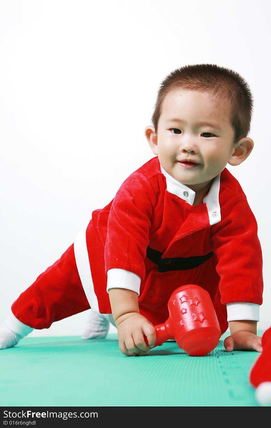 Cute chinese baby boy in a santas outfit. Cute chinese baby boy in a santas outfit