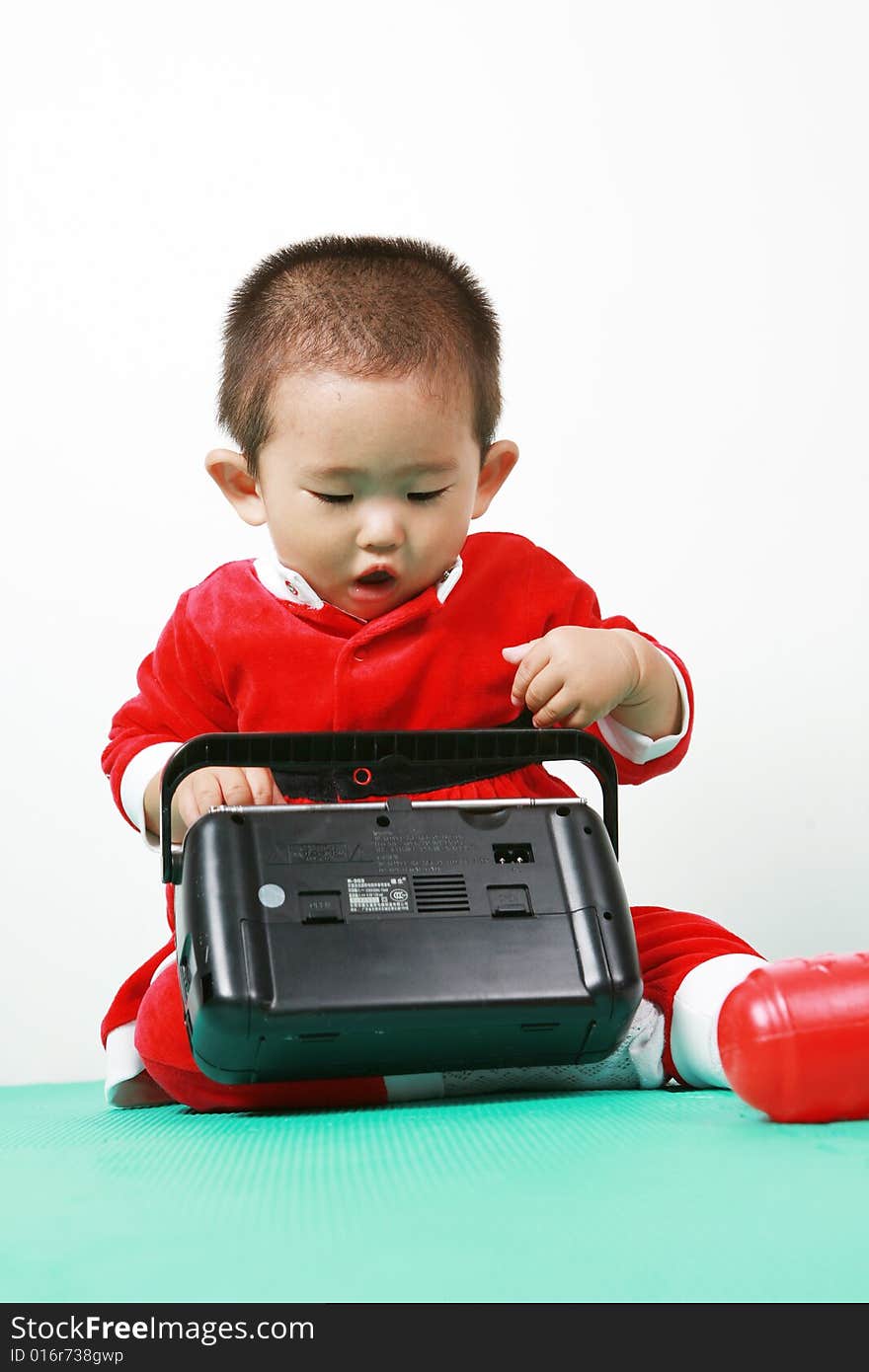 Cute chinese baby boy in a santas outfit. Cute chinese baby boy in a santas outfit